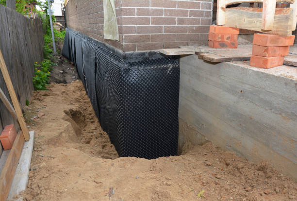 Happy homeowners after waterproofing job in Edgerton